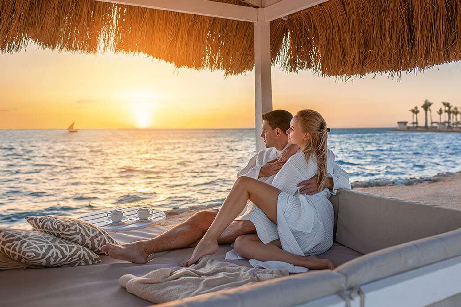 Couple watching sunset in Serengeti Zanzibar Beach Holiday