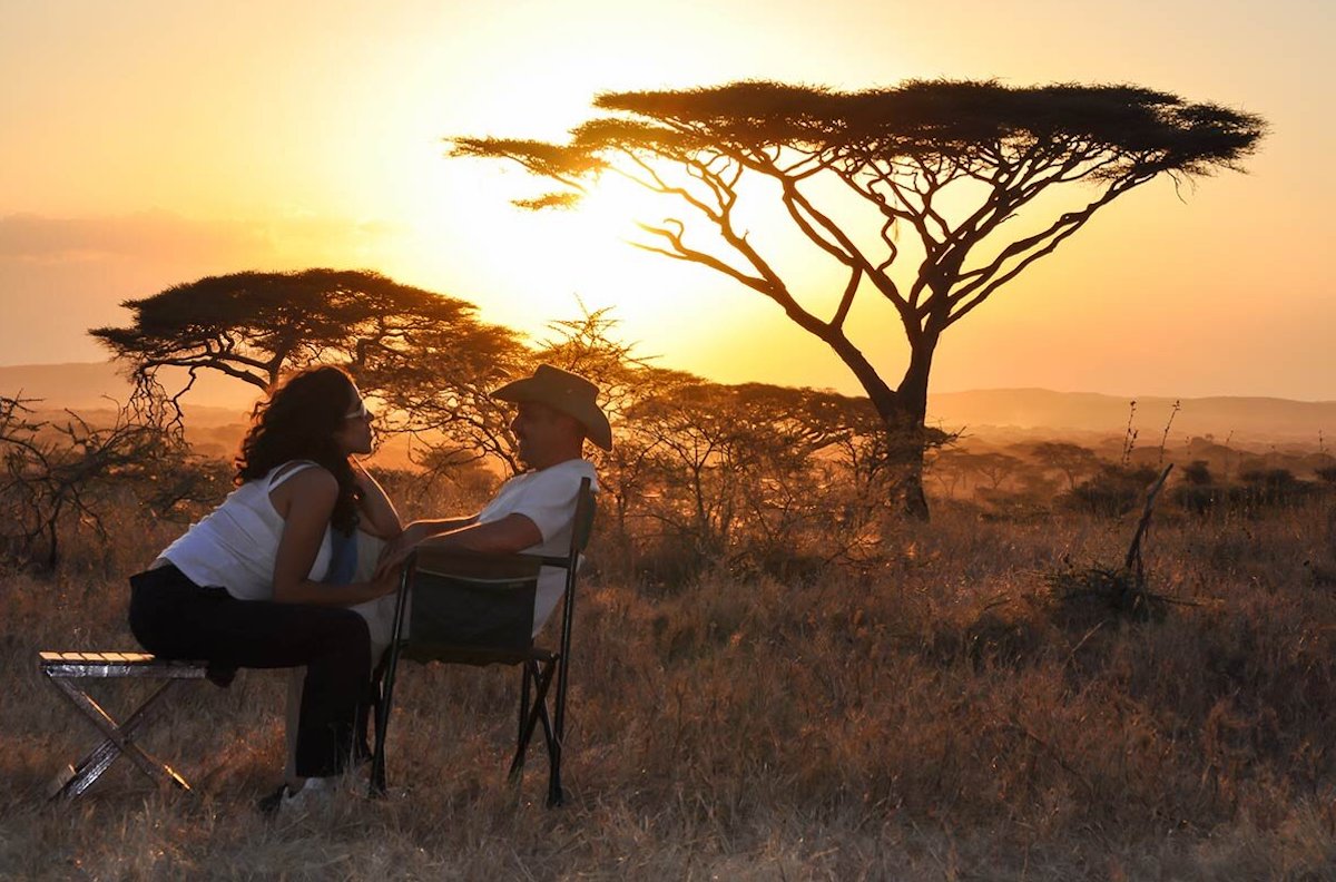 Evening romantic honeymoon safari moment in the African jungle
