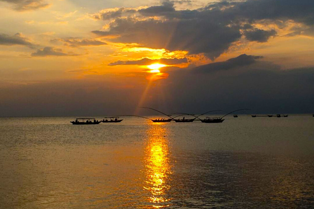 Lake Kivu provides one of the most romantic settings featured in Rwanda Honeymoon Safari Itineraries. Private sunset cruises allow couples to sail across the calm waters while watching the sun disappear behind the surrounding mountains. As the sky transforms into 