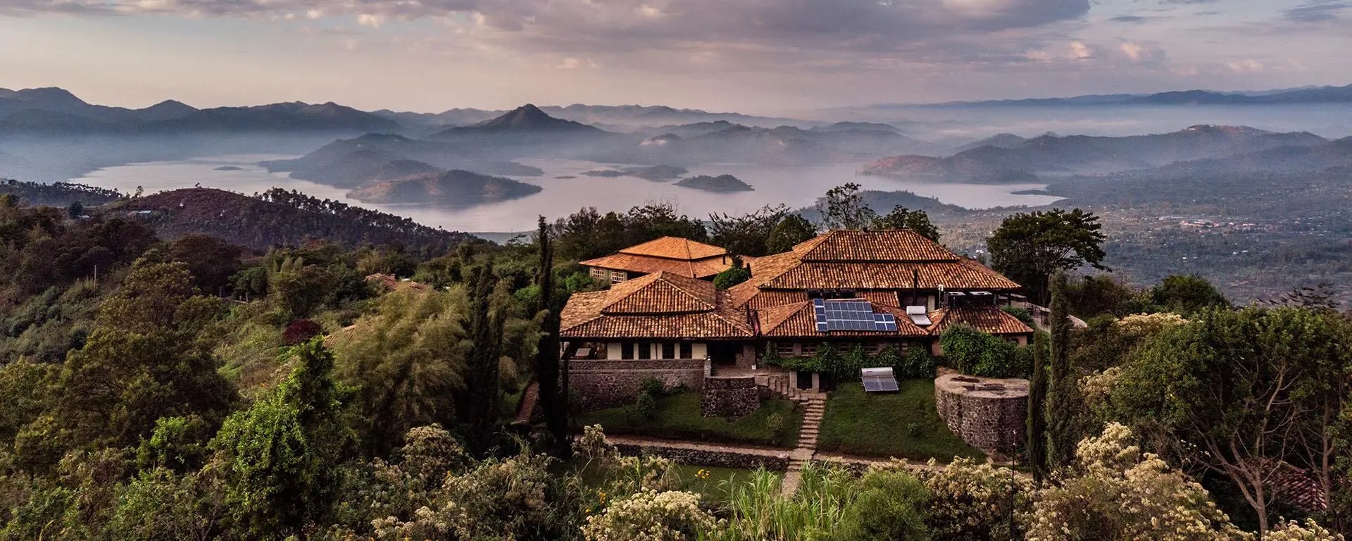 Virunga Lodge is famous for its breathtaking views over the twin lakes and volcanic peaks. Perched high on a ridge, it offers one of the most romantic sunset experiences in Rwanda. Honeymoon couples stay in beautifully designed bandas with private terraces, fireplaces,