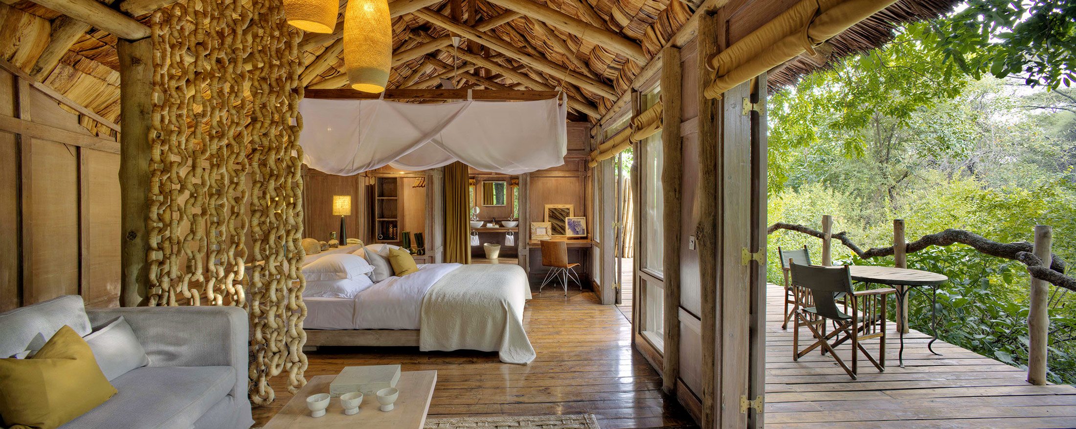 Lake Manyara Tree Lodge is the only luxury lodge located inside Lake Manyara National Park, offering honeymoon couples complete exclusivity surrounded by ancient mahogany forests. Spacious treehouse-style suites feature elegant interiors, outdoor showers, private verandas, and exceptional privacy, creating
